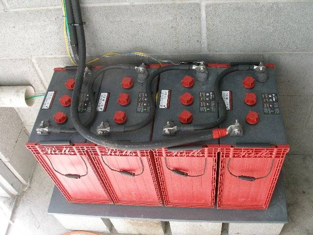 Four Surrette S-550 batteries.
